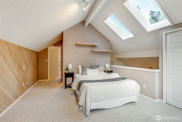 9230 119th St E, Puyallup, WA 98373 - bedroom with wooden walls, carpet floors, and lofted ceiling with skylight