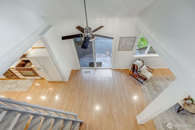 9230 119th St E, Puyallup, WA 98373 - additional living space featuring a ceiling fan, baseboards, and wood finished floors