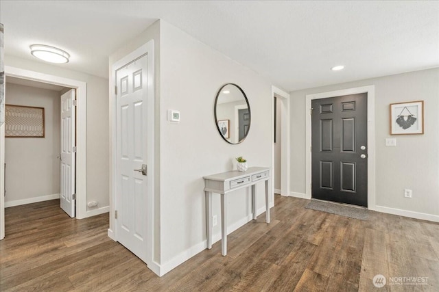 entryway featuring recessed lighting, baseboards, and wood finished floors