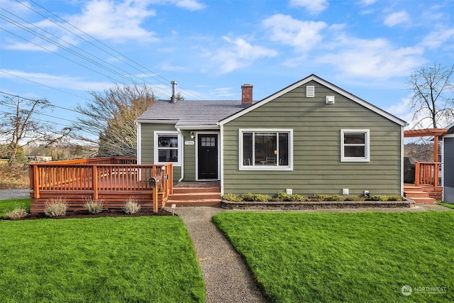 bungalow-style house featuring a pergola, a deck, and a front yard