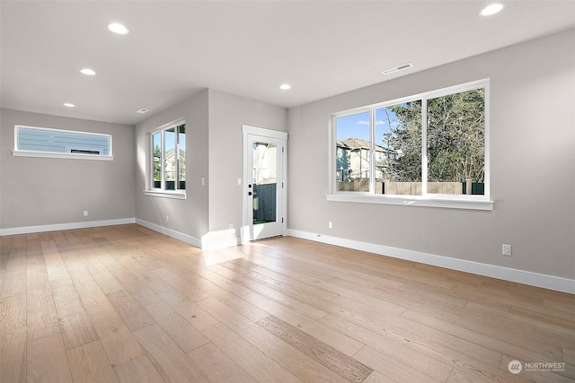 unfurnished living room featuring light wood-type flooring