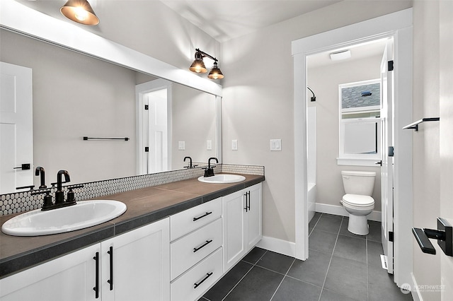 full bathroom featuring tile patterned flooring, vanity, shower / bathing tub combination, and toilet