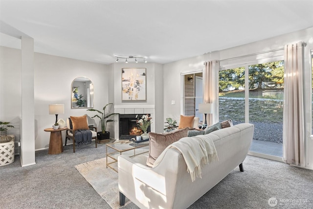 living room with light carpet and a fireplace