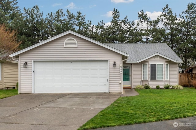 ranch-style home with a garage and a front lawn