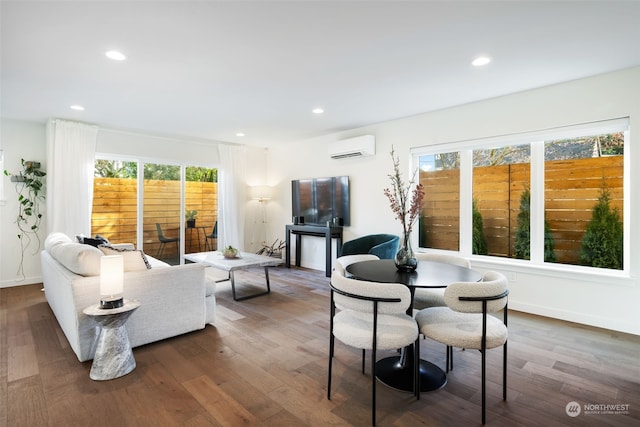 dining space featuring plenty of natural light, dark hardwood / wood-style floors, and a wall mounted air conditioner