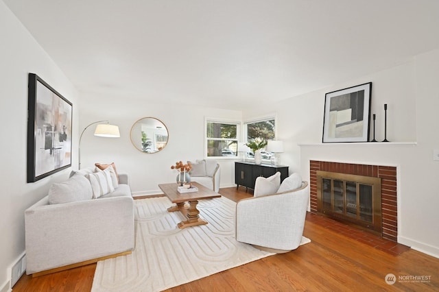 living room featuring a fireplace and hardwood / wood-style floors