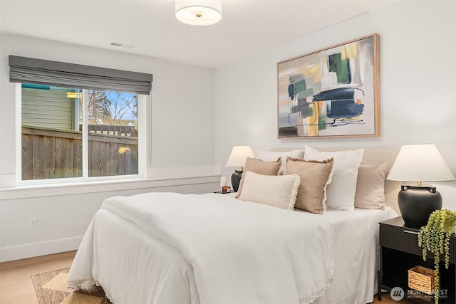 bedroom with wood-type flooring