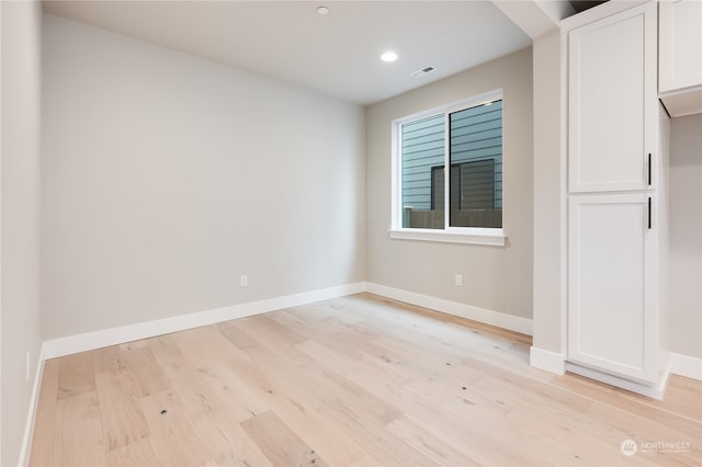 empty room with light wood-type flooring