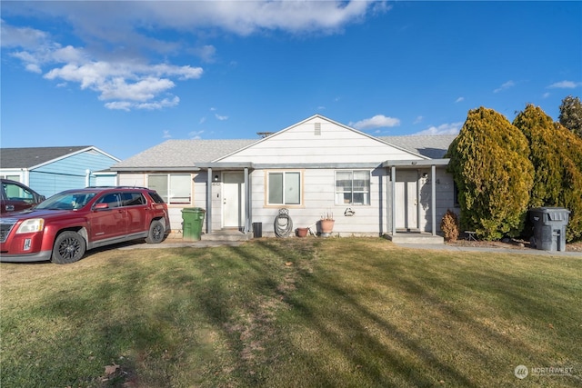 ranch-style house with a front lawn