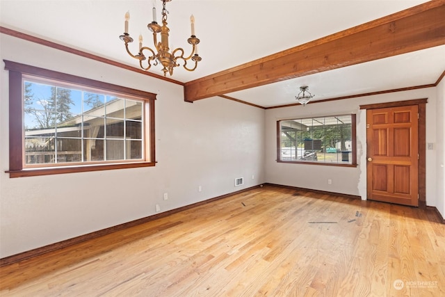 unfurnished dining area featuring an inviting chandelier, ornamental molding, beam ceiling, and light wood-type flooring