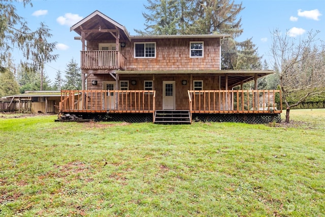 back of house featuring a yard and a deck