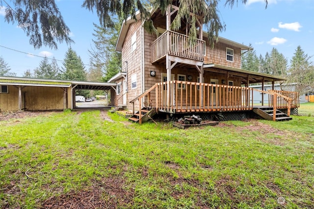 rear view of house featuring a deck and a lawn