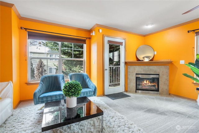 living room featuring light colored carpet, ornamental molding, and a fireplace