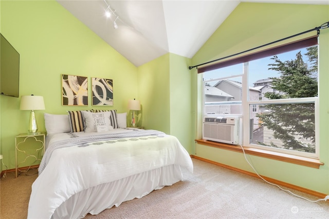 carpeted bedroom featuring lofted ceiling