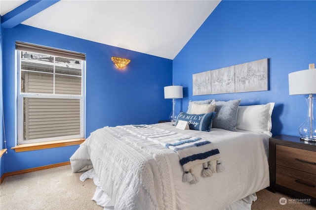 carpeted bedroom with lofted ceiling