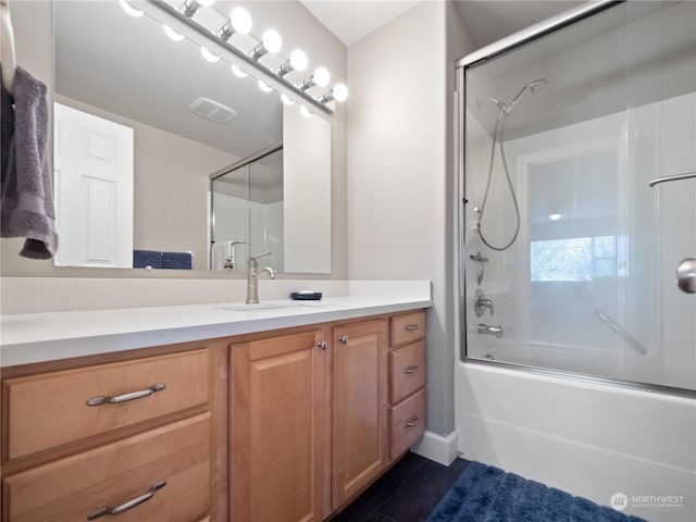 bathroom with vanity, combined bath / shower with glass door, and tile patterned floors