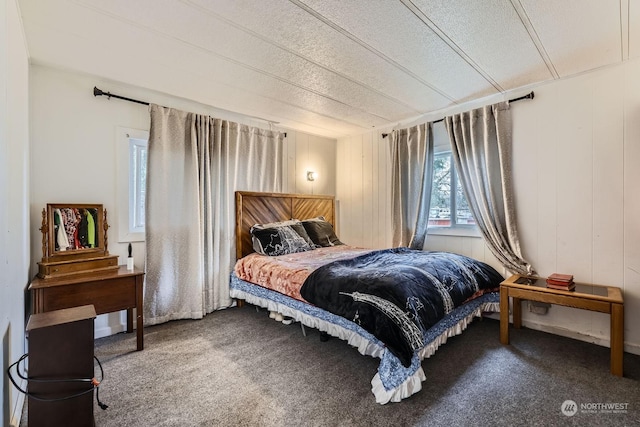 carpeted bedroom with a textured ceiling