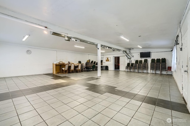 basement featuring light tile patterned floors