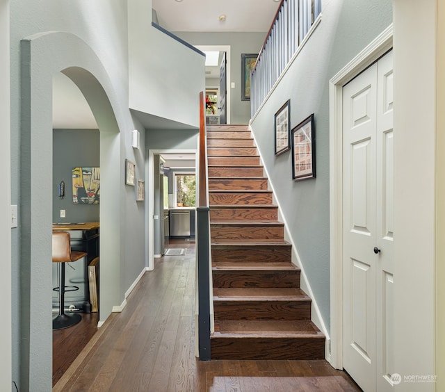 stairway featuring wood-type flooring