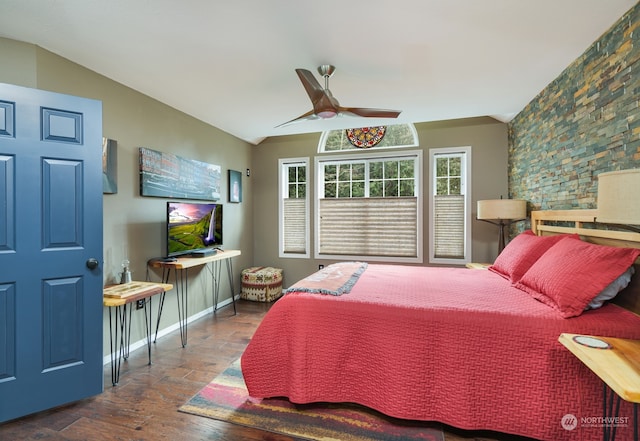 bedroom featuring ceiling fan, lofted ceiling, and dark hardwood / wood-style floors