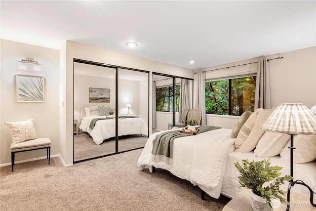 bedroom featuring recessed lighting, carpet, a closet, and baseboards