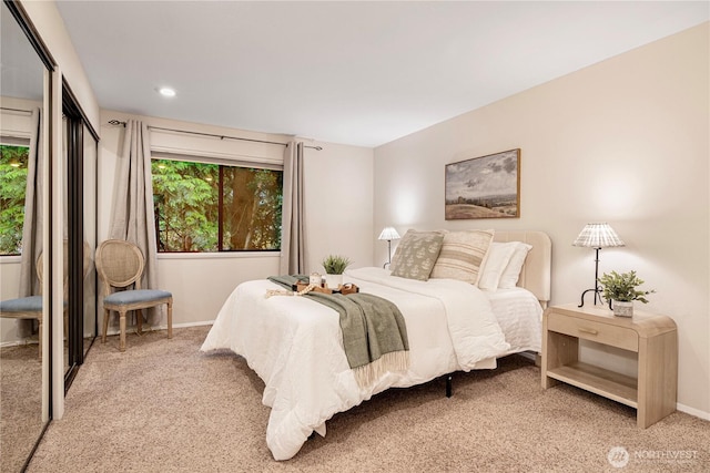 bedroom featuring baseboards, recessed lighting, and light carpet