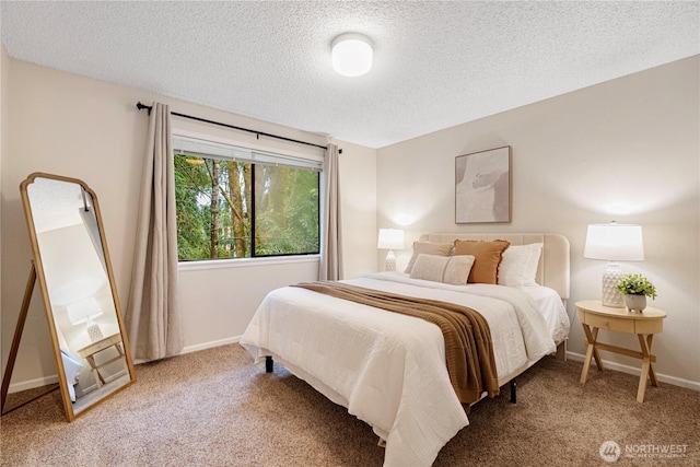 bedroom featuring a textured ceiling, carpet flooring, and baseboards