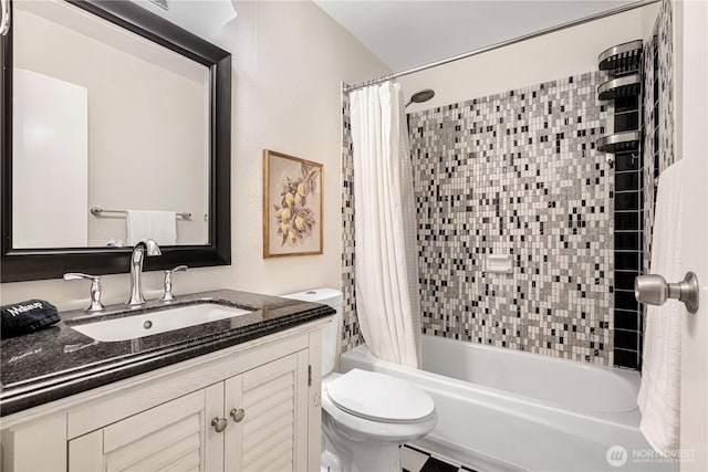 bathroom with toilet, vanity, and shower / bath combination with curtain