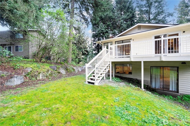 view of yard featuring stairs and a wooden deck
