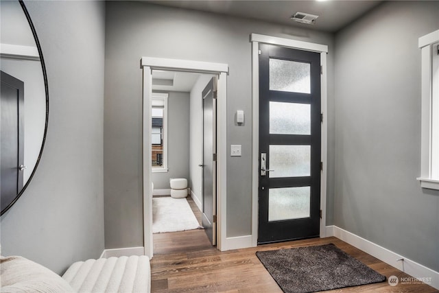 foyer entrance featuring hardwood / wood-style floors