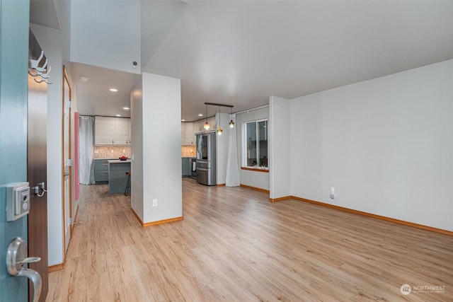 unfurnished living room with light hardwood / wood-style floors