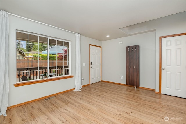 unfurnished room featuring light wood-type flooring