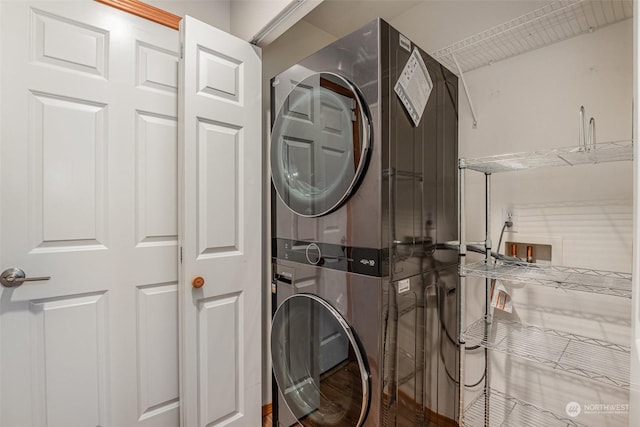 washroom with stacked washer / drying machine