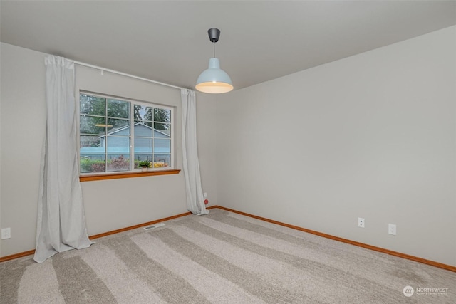 unfurnished room featuring carpet flooring