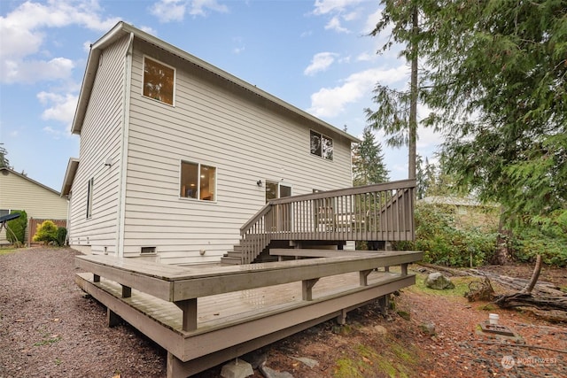 back of house featuring a deck