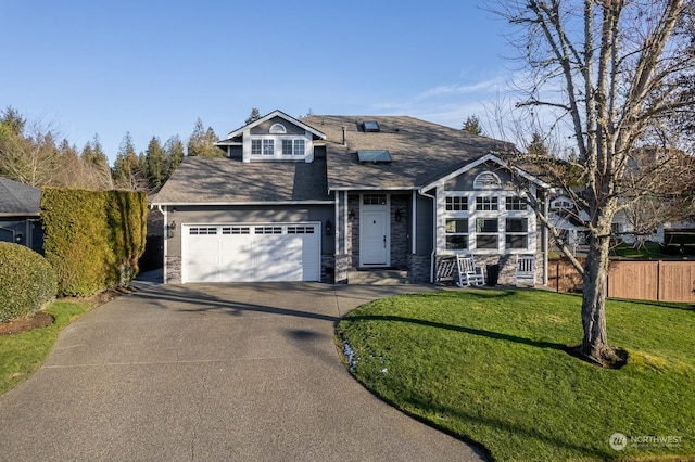 view of front of property with a garage and a front lawn