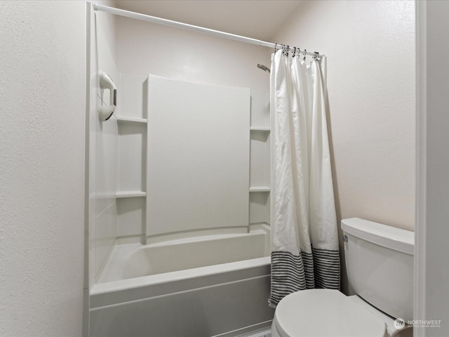 bathroom featuring toilet and shower / bath combo