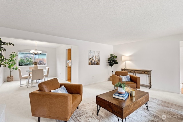 living room featuring an inviting chandelier, light colored carpet, and a textured ceiling