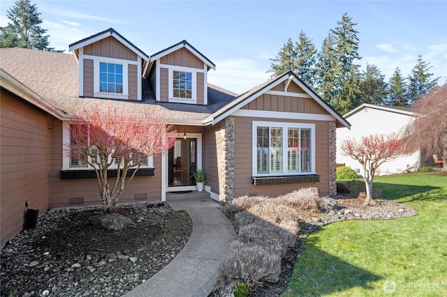 view of front of property featuring crawl space, a shingled roof, board and batten siding, and a front yard