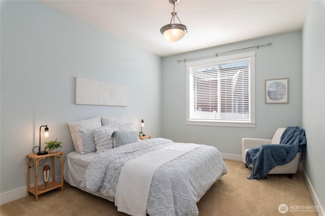 bedroom featuring carpet floors and baseboards