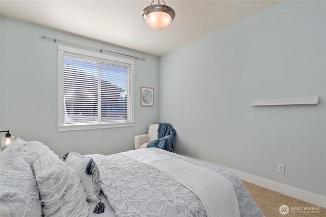 carpeted bedroom with baseboards