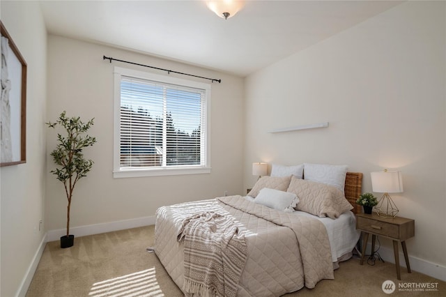 carpeted bedroom featuring baseboards