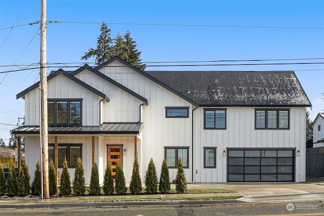 modern inspired farmhouse with a garage