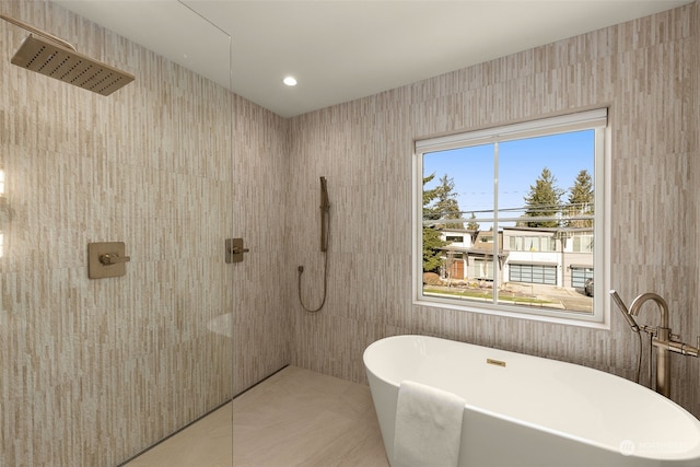 bathroom featuring separate shower and tub