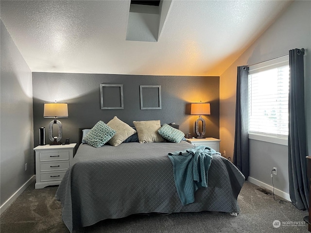 carpeted bedroom featuring vaulted ceiling and a textured ceiling