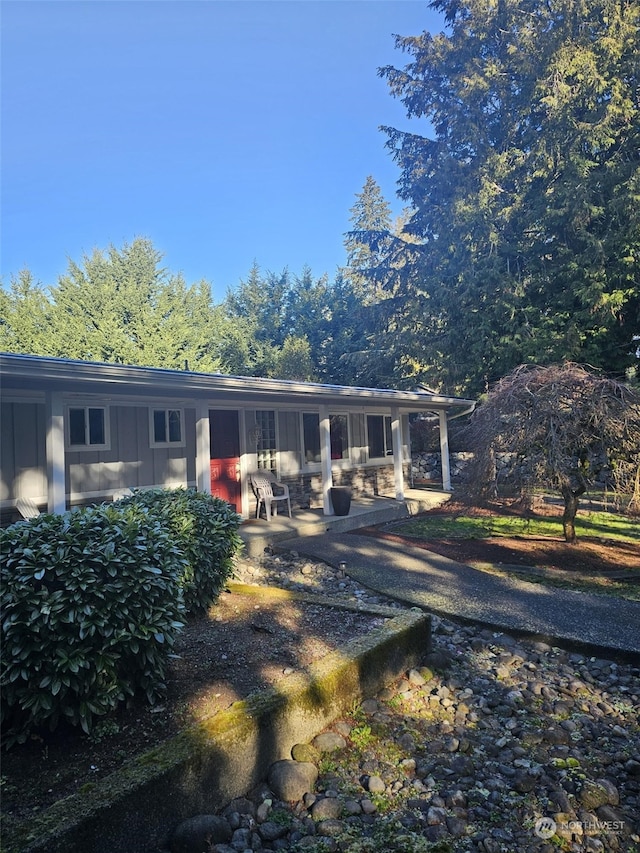 rear view of property featuring a patio