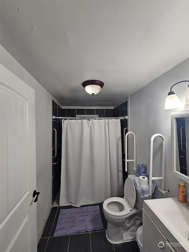 bathroom featuring vanity, a textured ceiling, toilet, and a shower with shower curtain