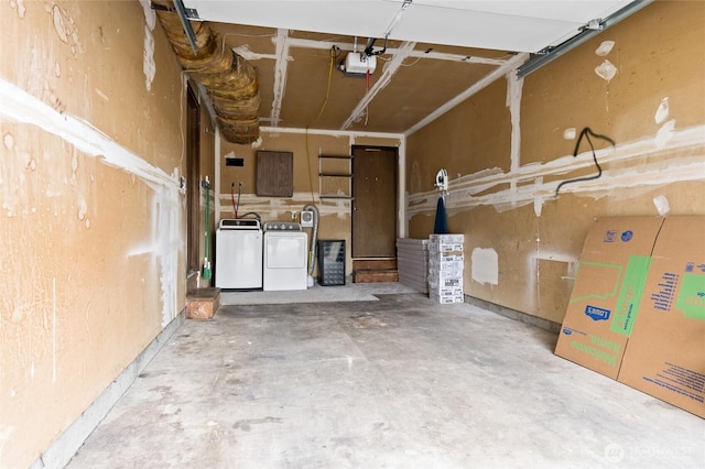 garage featuring a garage door opener and washing machine and dryer