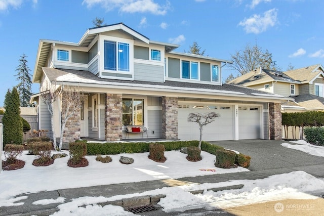 view of front of property featuring a garage and covered porch