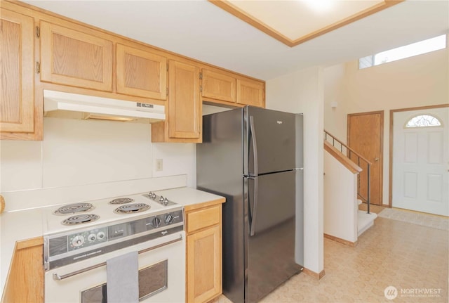 34126 30th Ave SW, Federal Way, WA 98023 - kitchen with range, under cabinet range hood, freestanding refrigerator, light countertops, and light floors